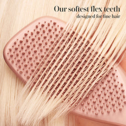 Model styling hair with the Tangle Teezer Complete Carebrush in Glazed Mocha