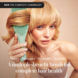 Model using the Tangle Teezer Complete Carebrush in Glistening Jade