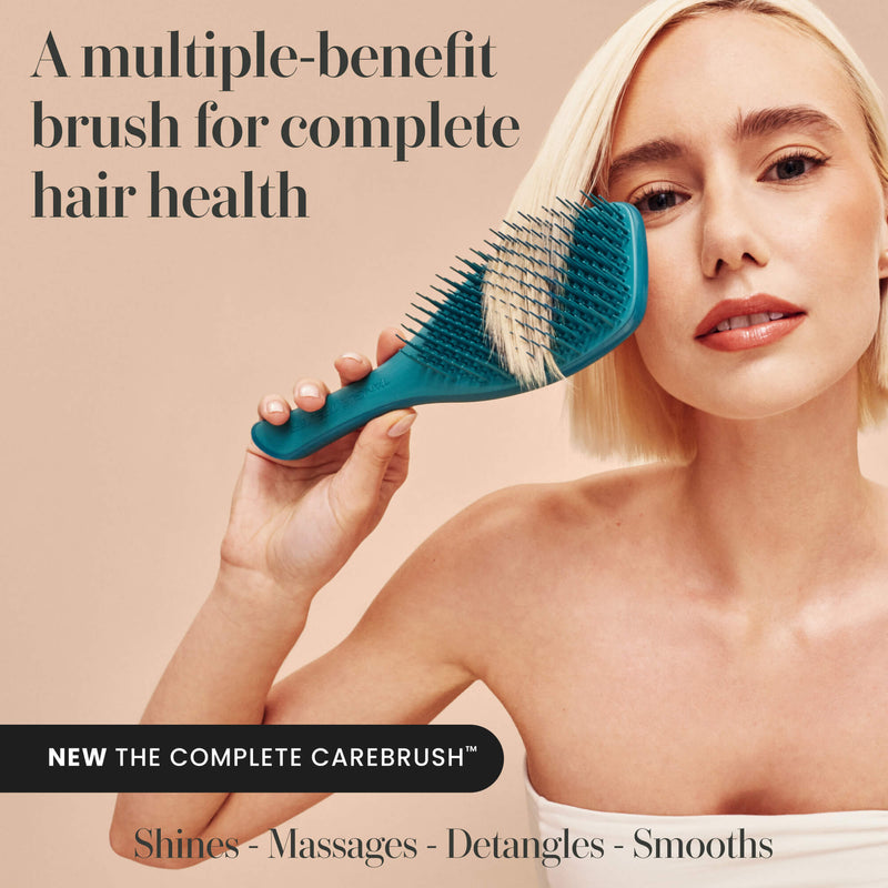 Model using the Tangle Teezer Complete Carebrush in Radiant Teal