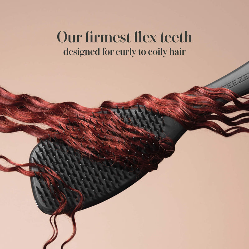 Model styling hair with the Tangle Teezer Complete Carebrush in Silken Slate